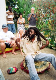 Photo of our guide showing his dreadlocks goes here.