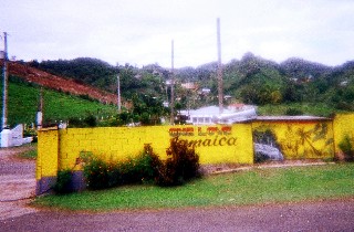 Photo of the compound where we ate on the Bob Marley Bus tour goes here.