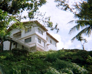Photo of Jamaica home on a hill goes here.