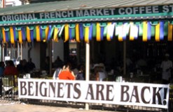 Beignets are Back sign at Cafe du Monde; photo goes here.