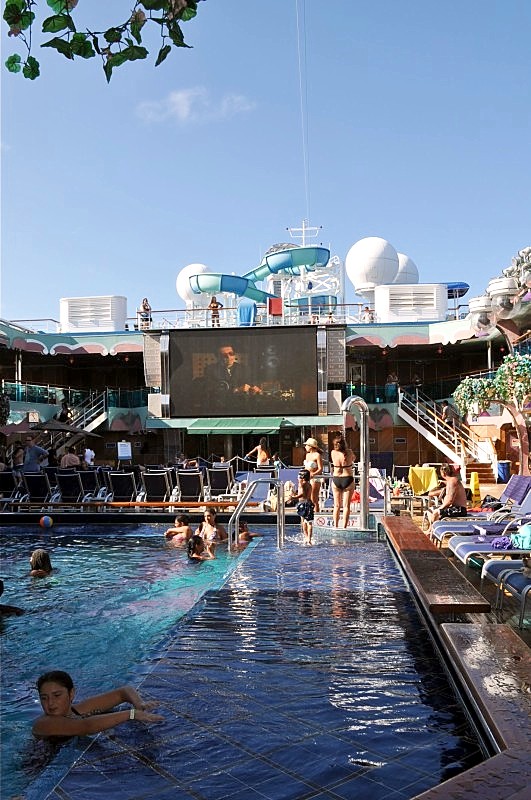 Photo of big movie screen above the main pool area goes here.*