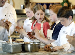 Photo of kids in a cooking class goes here.